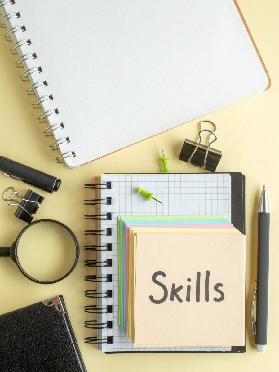 top-view-skills-written-note-along-with-colorful-little-paper-notes-light-background-notepad-job-pen-school-office-business-money-color-work-copybook_179666-18274